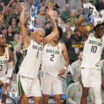
              Baylor players Flo Thamba (0), Jeremy Sochan (1), Kendall Brown (2) and Adam Flagler (10) celebrate on the bench during the second half of a college basketball game against the Norfolk State in the first round of the NCAA tournament in Fort Worth, Texas, Thursday, March 17, 2022. (AP Photo/LM Otero)
            