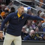 
              Michigan head coach Juwan Howard shouts during the first half of a college basketball game against Tennessee in the second round of the NCAA tournament, Saturday, March 19, 2022, in Indianapolis. (AP Photo/Darron Cummings)
            