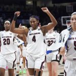 
              South Carolina forwards Aliyah Boston (4), Victaria Saxton (5) and Sania Feagin (20) celebrate after a first-round game against Howard in the NCAA women's college basketball tournament Friday, March 18, 2022 in Columbia, S.C. South Carolina won 79-21. (AP Photo/Sean Rayford)
            