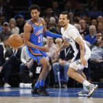 
              Oklahoma City Thunder guard Aaron Wiggins (21) and Orlando Magic guard Cole Anthony watch the ball get away during the first half of an NBA basketball game Wednesday, March 23, 2022, in Oklahoma City. (AP Photo/Garett Fisbeck)
            