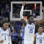 
              Duke guard Trevor Keels (1) celebrates with center Mark Williams (15) and forward Wendell Moore Jr. (0) during the second half of a college basketball game against Arkansas in the Elite 8 round of the NCAA men's tournament in San Francisco, Saturday, March 26, 2022. (AP Photo/Tony Avelar)
            