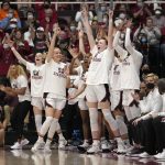 
              Stanford players react to a 3-point basket by teammate Anna Wilson during the first half of a second-round game against Kansas in the NCAA women's college basketball tournament Sunday, March 20, 2022, in Stanford, Calif. (AP Photo/Tony Avelar)
            