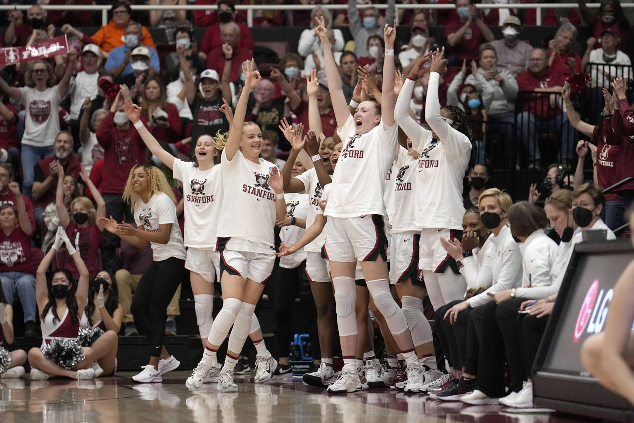 Stanford players react to a 3-point basket by teammate Anna Wilson during the first half of a secon...