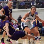 
              Maine's Maeve Carroll, right, drives against Albany's Ellen Hahne during the first half half of an NCAA college basketball game in the championship of the the America East Conference tournament, Friday, March 11, 2022, at Orono, Maine. (AP Photo/Robert F. Bukaty)
            