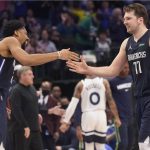 
              Dallas Mavericks guard Luka Doncic (77) celebrates with teammate Spencer Dinwiddie (26) during the second half of an NBA basketball game against the Minnesota Timberwolves in Dallas, Monday, March 21, 2022. (AP Photo/LM Otero)
            
