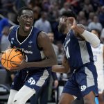 
              Saint Peter's forward Hassan Drame celebrates after grabbing a rebound during overtime in a college basketball game against Kentucky in the first round of the NCAA tournament, Thursday, March 17, 2022, in Indianapolis. Saint Peter's won 85-79. (AP Photo/Darron Cummings)
            