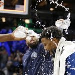 
              Minnesota Timberwolves guard Malik Beasley is doused with water by Minnesota Timberwolves guard D'Angelo Russell after setting a franchise record 11 three point baskets during an NBA basketball game against the Oklahoma City Thunder Wednesday, March 9, 2022, in Minneapolis. (AP Photo/Andy Clayton-King)
            