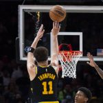 
              Golden State Warriors guard Klay Thompson (11) shoots a 3-point basket during the first half of an NBA basketball game against the Atlanta Hawks, Friday, March 25, 2022, in Atlanta. (AP Photo/Hakim Wright Sr.)
            