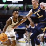 
              Montana State guard Xavier Bishop drives against Northern Colorado guard Dalton Knecht (5) during the first half of an NCAA college basketball game for the championship of the Big Sky men's tournament in Boise, Idaho, Saturday, March 12, 2022. (AP Photo/Otto Kitsinger)
            