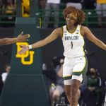 
              Baylor forward NaLyssa Smith (1) gets a congratulations from teammate Jordan Lewis (3) during at the second half of a college basketball game against Hawaii in the first round of the NCAA tournament in Waco, Texas, Friday, March 18, 2022. Baylor won 89-49. (AP Photo/LM Otero)
            