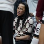 
              South Carolina head coach Dawn Staley talks with her players during a timeout in the first half of an NCAA college basketball semifinal round game against Mississippi at the women's Southeastern Conference tournament Saturday, March 5, 2022, in Nashville, Tenn. (AP Photo/Mark Humphrey)
            