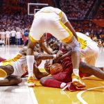 
              Arkansas forward Kamani Johnson (20) battles for the ball with Tennessee guard Josiah-Jordan James (30) during the second half of an NCAA college basketball game Saturday, March 5, 2022, in Knoxville, Tenn. Tennessee won 78-74. (AP Photo/Wade Payne)
            
