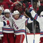 
              New York Rangers center Andrew Copp, second from left, celebrates his goal in overtime during an NHL hockey game against the Detroit Red Wings Wednesday, March 30, 2022, in Detroit. The Rangers won 5-4. (AP Photo/Paul Sancya)
            
