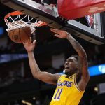 
              Los Angeles Lakers' Malik Monk dunks the ball against the Houston Rockets during the first half of an NBA basketball game Wednesday, March 9, 2022, in Houston. (AP Photo/David J. Phillip)
            