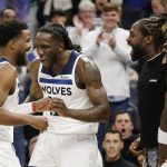 
              Minnesota Timberwolves guard Malik Beasley (5) is congratulated by teammates Taurean Prince (12), Patrick Beverley and Anthony Edwards (1) after setting a franchise record 11 three point baskets during the second half of an NBA basketball game against the Oklahoma City Thunder Wednesday, March 9, 2022, in Minneapolis. (AP Photo/Andy Clayton-King)
            