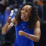 
              Kentucky head coach Kyra Elzy directs her players in the first half of an NCAA college basketball semifinal round game against Tennessee at the women's Southeastern Conference tournament Saturday, March 5, 2022, in Nashville, Tenn. (AP Photo/Mark Humphrey)
            