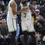 
              Boston Celtics guard Jaylen Brown (7) is congratulated by center Al Horford after scoring and being fouled against the Golden State Warriors during the first half of an NBA basketball game in San Francisco, Wednesday, March 16, 2022. (AP Photo/Jeff Chiu)
            