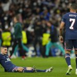 
              PSG's Kylian Mbappe, right, and teammate Marco Verratti react to their loss in the Champions League, round of 16, second leg soccer match between Real Madrid and Paris Saint-Germain at the Santiago Bernabeu stadium in Madrid, Spain, Wednesday, March 9, 2022. (AP Photo/Manu Fernandez)
            