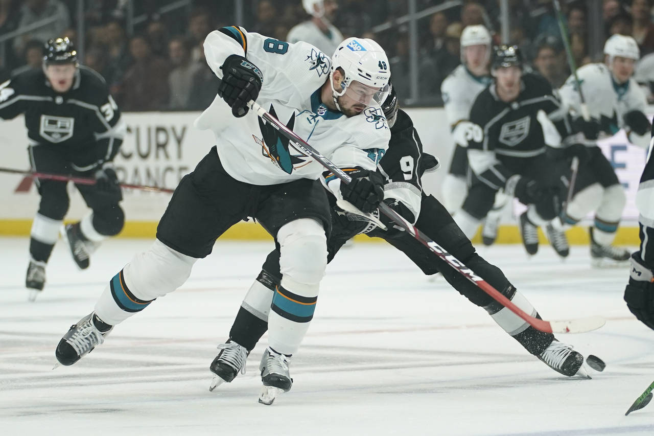 San Jose Sharks center Tomas Hertl (48) shoots while defended by Los Angeles Kings center Adrian Ke...