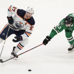 
              Edmonton Oilers center Connor McDavid (97) and Dallas Stars left wing Marian Studenic (43) skate for control of the puck during the first period of an NHL hockey game in Dallas, Tuesday, March 22, 2022. (AP Photo/LM Otero)
            