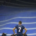 
              PSG's Kylian Mbappe reacts after Real Madrid scored their side's third goal during the Champions League, round of 16, second leg soccer match between Real Madrid and Paris Saint-Germain at the Santiago Bernabeu stadium in Madrid, Spain, Wednesday, March 9, 2022. (AP Photo/Manu Fernandez)
            