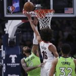 
              Minnesota Timberwolves guard D'Angelo Russell (0) fouls Portland Trail Blazers guard CJ Elleby (16) during the first half of an NBA basketball game Saturday, March 5, 2022, in Minneapolis. (AP Photo/Stacy Bengs)
            