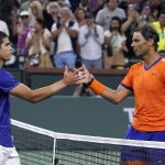 
              Rafael Nadal, of Spain, right, greets Carlos Alcaraz, of Spain, after defeating him in the men's singles semifinals at the BNP Paribas Open tennis tournament Saturday, March 19, 2022, in Indian Wells, Calif. Nadal won 6-4, 4-6, 6-3. (AP Photo/Mark J. Terrill)
            
