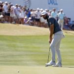 
              Dustin Johnson putts on the 13th green during the quarterfinal round of the Dell Technologies Match Play Championship golf tournament, Saturday, March 26, 2022, in Austin, Texas. (AP Photo/Tony Gutierrez)
            