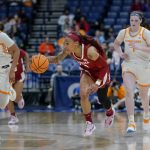 
              Alabama's JaMya Mingo-Young, center, brings the ball up the court ahead of Tennessee's Alexus Dye (2) and Sara Puckett (1) in the first half of an NCAA college basketball game at the women's Southeastern Conference tournament Friday, March 4, 2022, in Nashville, Tenn. (AP Photo/Mark Humphrey)
            