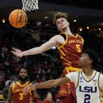 
              Iowa State's Aljaz Kunc and LSU's Eric Gaines go after a loose ball during the first half of a first round NCAA college basketball tournament game Friday, March 18, 2022, in Milwaukee. (AP Photo/Morry Gash)
            