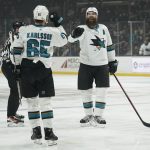 
              San Jose Sharks defenseman Brent Burns, right, celebrates with defenseman Erik Karlsson (65) after scoring during the first period of an NHL hockey game against the Los Angeles Kings Thursday, March 10, 2022, in Los Angeles. (AP Photo/Ashley Landis)
            