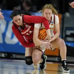 
              Georgia center Jenna Staiti (14) fights for a loose ball with Iowa State guard Emily Ryan, right, during the second half of a second-round game in the NCAA women's college basketball tournament, Sunday, March 20, 2022, in Ames, Iowa. (AP Photo/Charlie Neibergall)
            