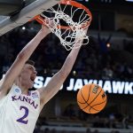 
              Kansas' Christian Braun dunks during the second half of a college basketball game in the Elite 8 round of the NCAA tournament Sunday, March 27, 2022, in Chicago. (AP Photo/Nam Y. Huh)
            
