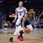 
              New Orleans Pelicans guard CJ McCollum (3) drives to the basket past Sacramento Kings guard Donte DiVincenzo (0) in the second half of an NBA basketball game in New Orleans, Wednesday, March 2, 2022. The Pelicans won 125-95. (AP Photo/Gerald Herbert)
            