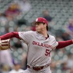 
              Oklahoma pitcher Jake Bennett throws against LSU during the first inning of an NCAA college baseball game at Minute Maid Park, home of the Houston Astros, Friday, March 4, 2022, in Houston. College baseball might turn out to be an attractive alternative for baseball fans if the Major League Baseball lockout extends deep into the spring. (AP Photo/David J. Phillip)
            