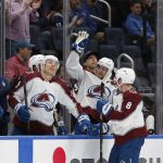 
              Colorado Avalanche defenseman Devon Toews (7), a former New York Islanders player, acknowledges the fans during a video tribute during a timeout during the first period an NHL hockey game against the Islanders, Monday, March 7, 2022, in Elmont, N.Y. (AP Photo/Jim McIsaac)
            