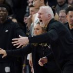 
              San Antonio Spurs head coach Gregg Popovich signals to his players during the second half of an NBA basketball game against the Utah Jazz, Friday, March 11, 2022, in San Antonio. The Spurs won, making Popovich the all-time winningest coach in NBA regular-season history. (AP Photo/Eric Gay)
            