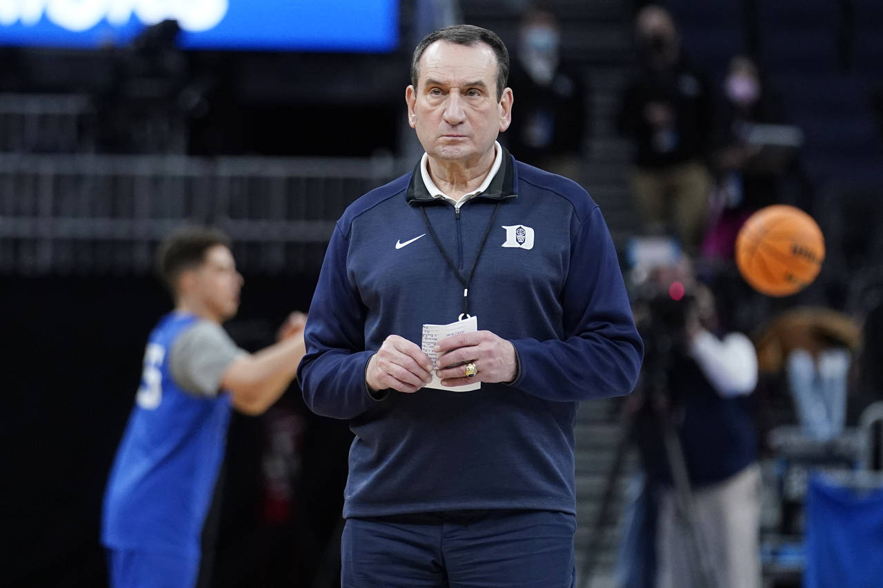 Duke head coach Mike Krzyzewski watches his team during practice for the NCAA men's college basketb...