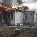 
              A house is on fire following shelling on the town of Irpin, 26 kilometers west of Kyiv, Ukraine, Friday, March 4, 2022. Russia's war on Ukraine is now in its ninth day and Russian forces have shelled Europe's largest nuclear power plant, sparking a fire there that was extinguished overnight. (AP Photo/Oleksandr Ratushniak)
            