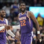 
              Phoenix Suns forward Jae Crowder, left, congratulates center Deandre Ayton at the end of the team's NBA basketball game against the Denver Nuggets on Thursday, March 24, 2022, in Denver. (AP Photo/David Zalubowski)
            