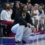 
              Georgia head coach Joni Taylor watches from the sideline in the second half of an NCAA college basketball game against Alabama at the women's Southeastern Conference tournament Thursday, March 3, 2022, in Nashville, Tenn. (AP Photo/Mark Humphrey)
            