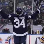 
              Toronto Maple Leafs forward Auston Matthews (34) celebrates after scoring against Buffalo Sabres goaltender Craig Anderson, right, during second-period NHL Heritage Classic hockey game action in Hamilton, Ontario, Sunday, March 13, 2022. (Frank Gunn/The Canadian Press via AP)
            