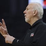 
              San Antonio Spurs head coach Greg Popovich talks with his team during the first half of an NBA basketball game against the Golden State Warriors in San Francisco, Sunday, March 20, 2022. (AP Photo/Jed Jacobsohn)
            
