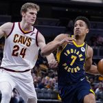 
              Indiana Pacers guard Malcolm Brogdon (7) drives on Cleveland Cavaliers forward Lauri Markkanen (24) during the second half of an NBA basketball game in Indianapolis, Tuesday, March 8, 2022. The Cavaliers won 127-124. (AP Photo/Michael Conroy)
            