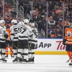 
              Los Angeles Kings celebrate a goal as Edmonton Oilers' Evan Bouchard (75) skates past during the second period of an NHL hockey game Wednesday, March 30, 2022, in Edmonton, Alberta. (Jason Franson/The Canadian Press via AP)
            