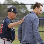 
              Atlanta Braves manager Brian Snitker gives the team's new first baseman Matt Olson a pat on the back as he arrives at baseball spring training camp in North Port, Fla., Tuesday, March 15, 2022. The Braves signed Olson to a $168 million, eight-year contract. (Curtis ComptonAtlanta Journal-Constitution via AP)
            