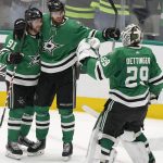 
              Dallas Stars center Tyler Seguin (91) celebrates his empty-net goal with Jani Hakanpaa (2) and goaltender Jake Oettinger (29) during the third period of the team's NHL hockey game against the Edmonton Oilers in Dallas, Tuesday, March 22, 2022. The Stars won 5-3. (AP Photo/LM Otero)
            