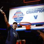 
              Villanova's Collin Gillespie celebrates after cutting down the net after the final of the Big East conference tournament against Creighton, Saturday, March 12, 2022, in New York. (AP Photo/Frank Franklin II)
            