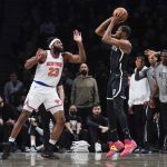 
              Brooklyn Nets' Kevin Durant, right, shoots over New York Knicks' Mitchell Robinson during the first half of the NBA basketball game at the Barclays Center, Sunday, Mar. 13, 2022, in New York. (AP Photo/Seth Wenig)
            