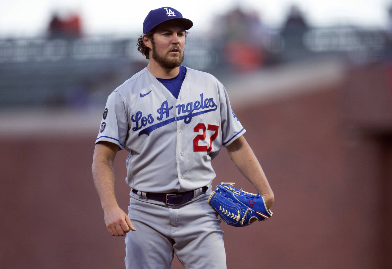 FILE - Los Angeles Dodgers starting pitcher Trevor Bauer looks toward home during the fourth inning...